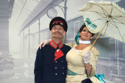 Stationmaster with lady